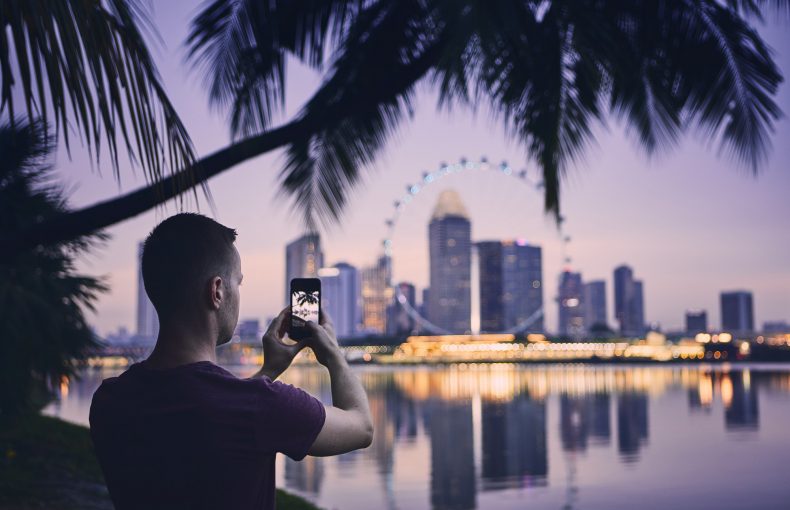 Tourist taking photo of Singapore