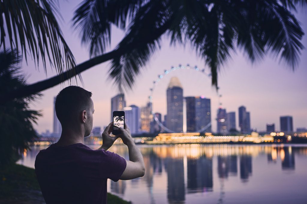 Tourist taking photo of Singapore